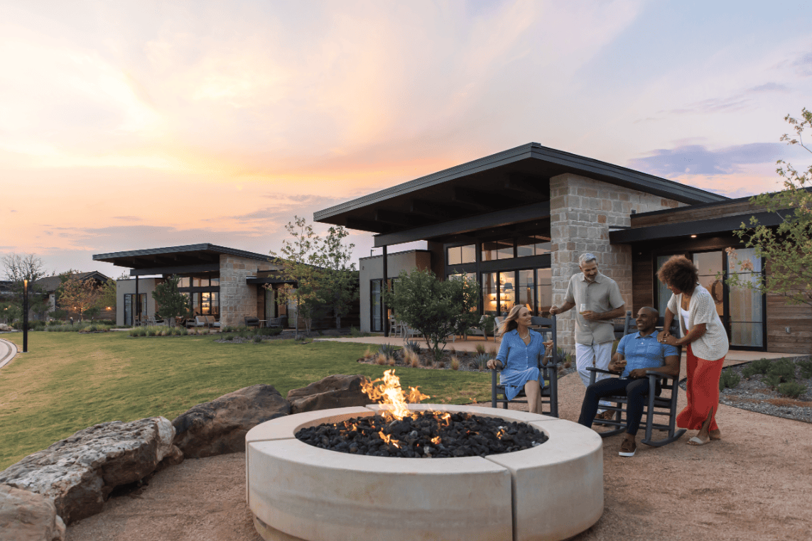 People sitting around fire pit